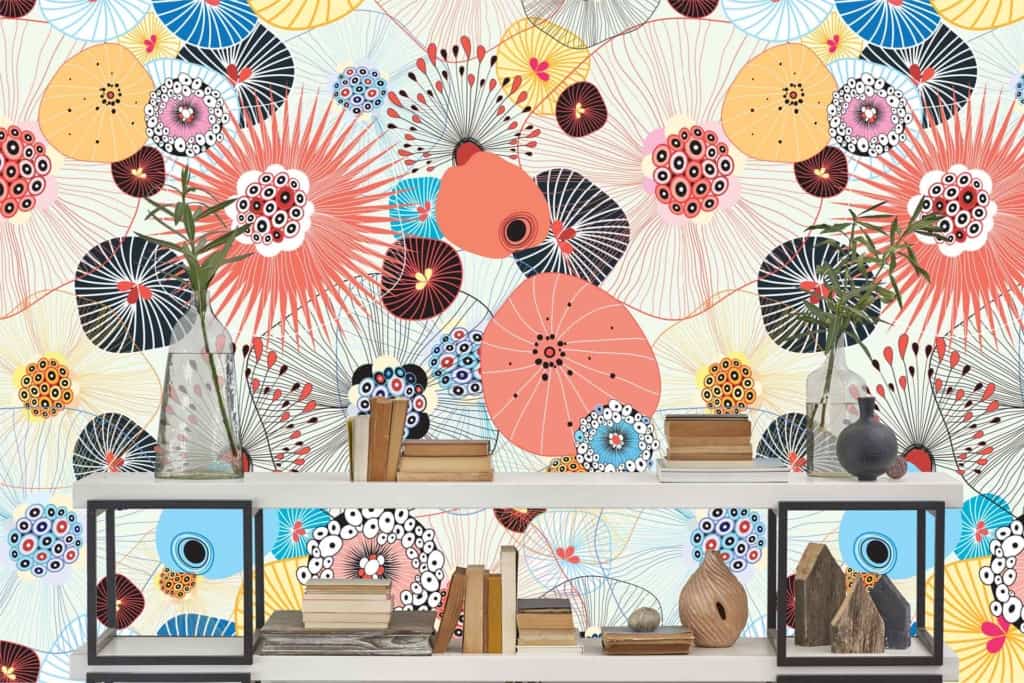 Vibrant, abstract wallpaper with circular, floral-inspired patterns. Bright colors: blue, yellow, red, and black. Dynamic and lively background.