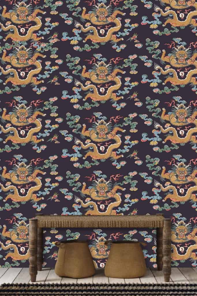 A dark wallpaper with an intricate pattern of yellow dragons and red clouds, accented with green and blue details.
