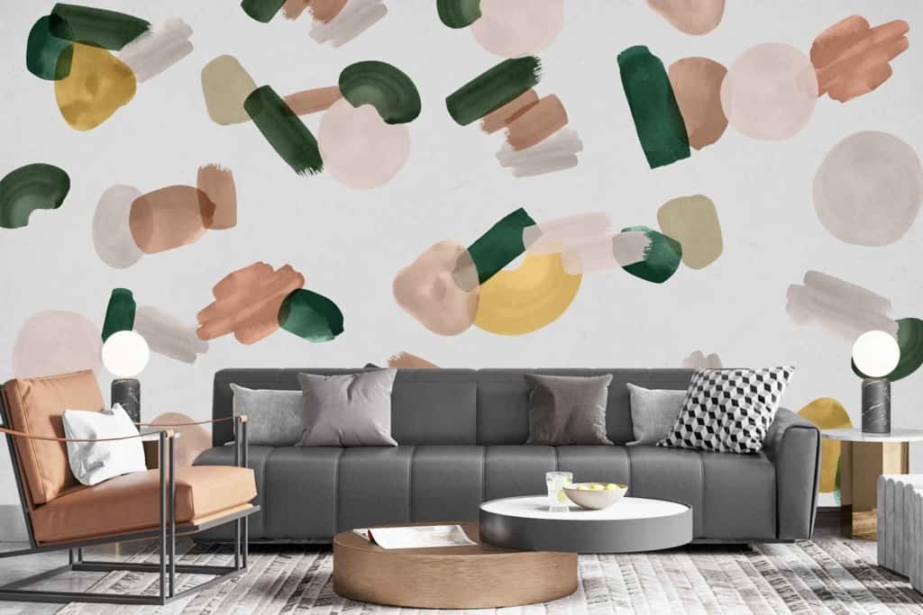 The wallpaper features an abstract pattern with green, brown, beige, and yellow brush strokes and shapes.