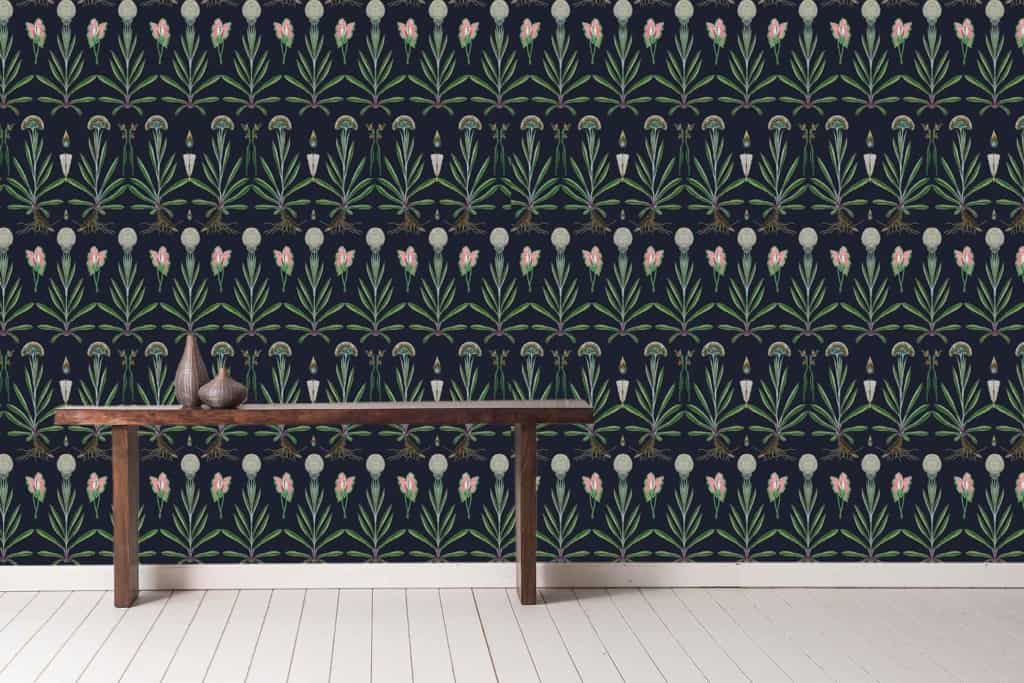 The wallpaper features a repeating botanical pattern with green leaves and pink flowers set against a dark-colored background.