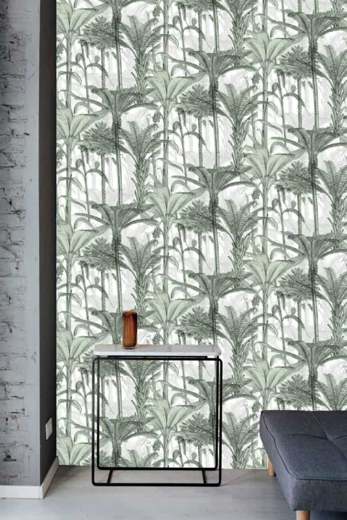 The wallpaper features a lively green and white botanical pattern with elegant palm tree designs, accentuating vibrant green leaves against a crisp white background.