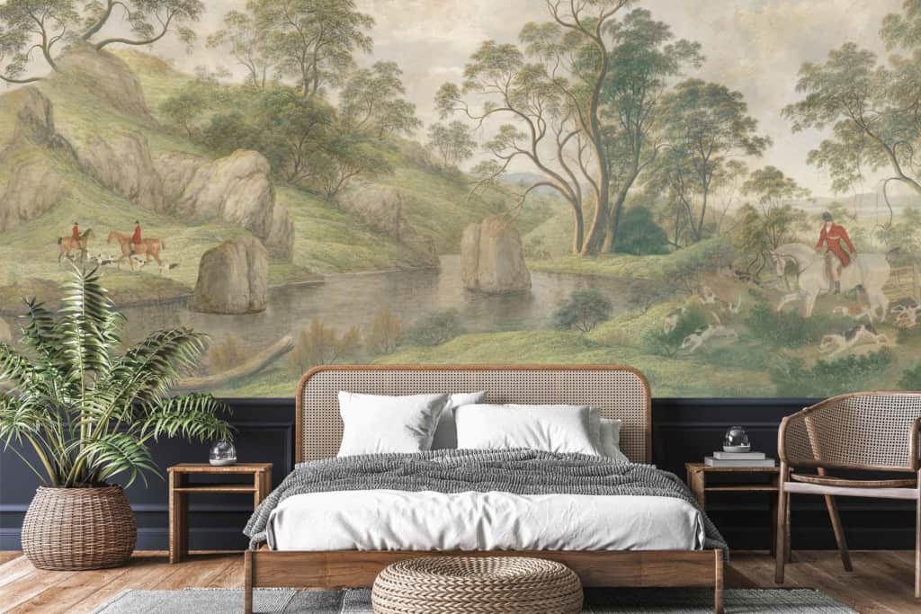 The luxury bedroom features a stunning nature-themed wallpaper inspired by *The Hunter*. The wallpaper showcases a serene landscape with tall, majestic **trees**, rugged **rocks**, a gently flowing **river**, and two horseback riders captured in motion. The color palette includes lush **greens** of the foliage, earthy **browns** of the rocks, deep **blues** of the river, and warm tones from the riders' attire. This visually arresting backdrop perfectly complements the room's sophisticated decor and can be easily found using search terms like "nature-themed wallpaper," "serene landscape," "trees, rocks, river," and "horseback riders.