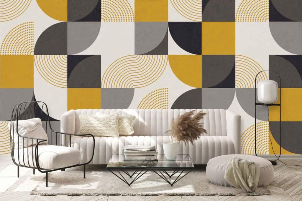 Geometric wallpaper with yellow, black, gray, and white shapes.