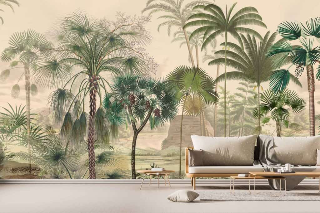 A stylish living room features a large, detailed mural wallpaper showcasing an array of tropical plants and trees. The design includes vivid green palm fronds, lush ferns, exotic flora with hues of deep emerald and jade, and intricate tree trunks in rich browns. Splashes of vibrant tropical flowers in colors such as bold reds, striking oranges, and soft pinks enhance the lush jungle scene. The mural evokes the untamed beauty of uncharted territories with its captivating organic elements and varied shades echoing nature's bounty.