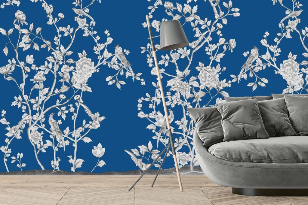 Vibrant blue wallpaper with intricate white floral and bird patterns, reminiscent of the opulence of the Palace of Versailles.