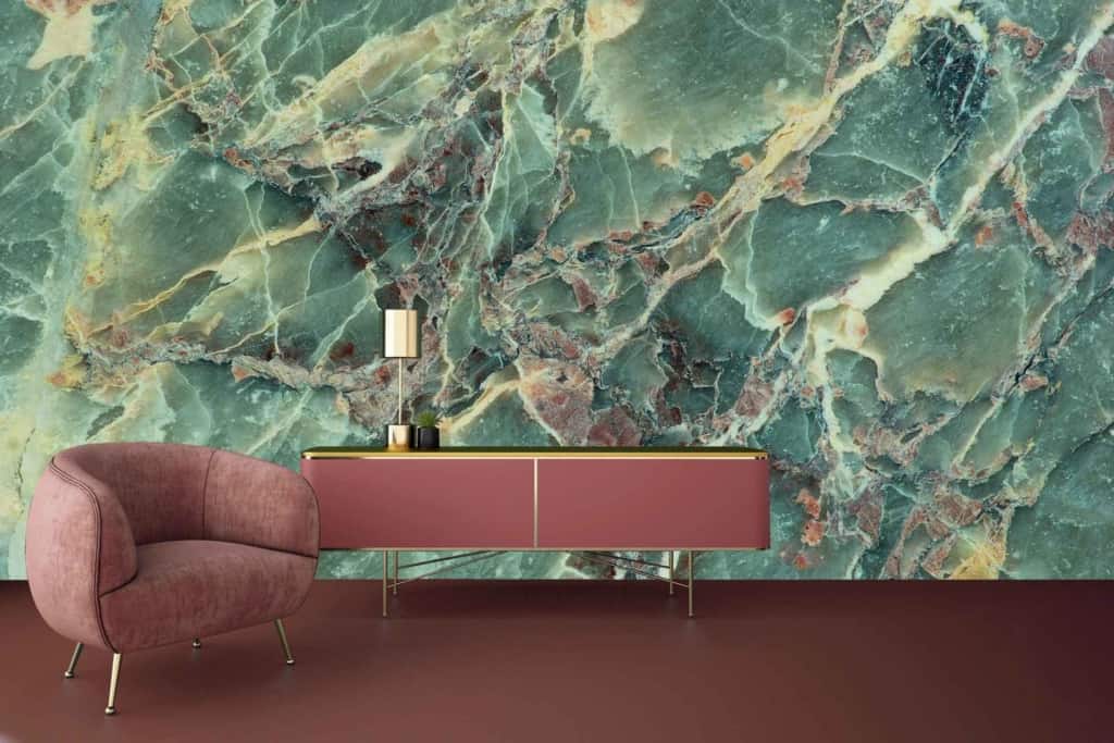 A modern interior features a textured green and brown marble wall. The wallpaper highlights green, brown, and marble textures.