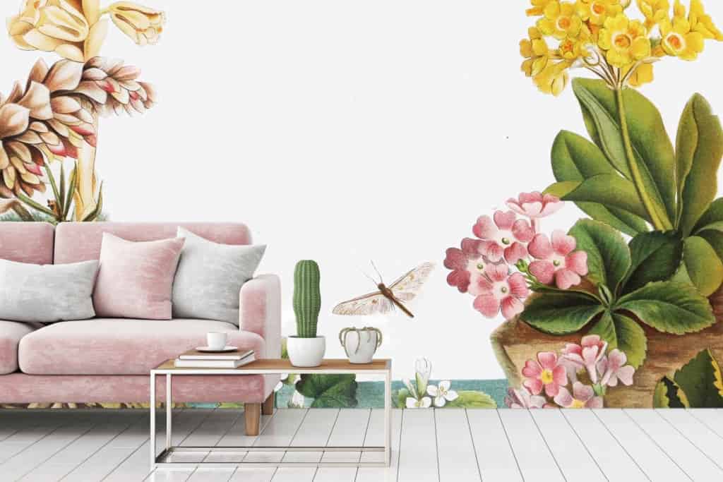 The white wall is adorned with large, colorful botanical illustrations featuring vibrant hues. The wallpaper design includes a variety of plant species with detailed leaves and flowers in shades of green, pink, yellow, and blue.