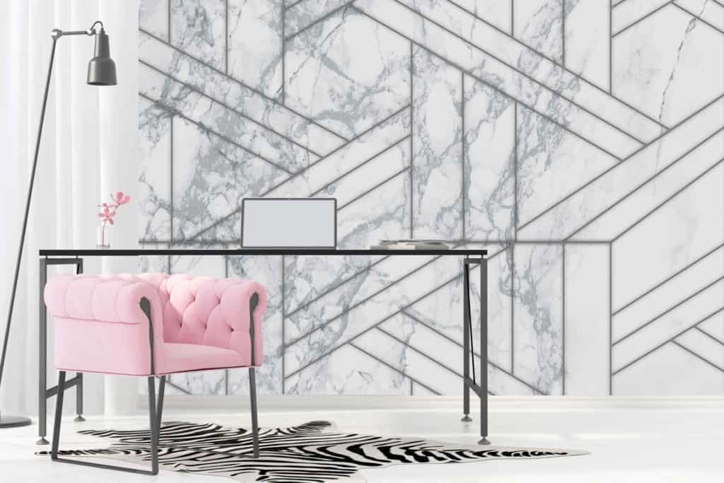 The wallpaper features abstract geometric patterns and shapes reminiscent of New York landmarks. It includes a mix of marble textures with white, gray, and black hues to create a sophisticated backdrop.