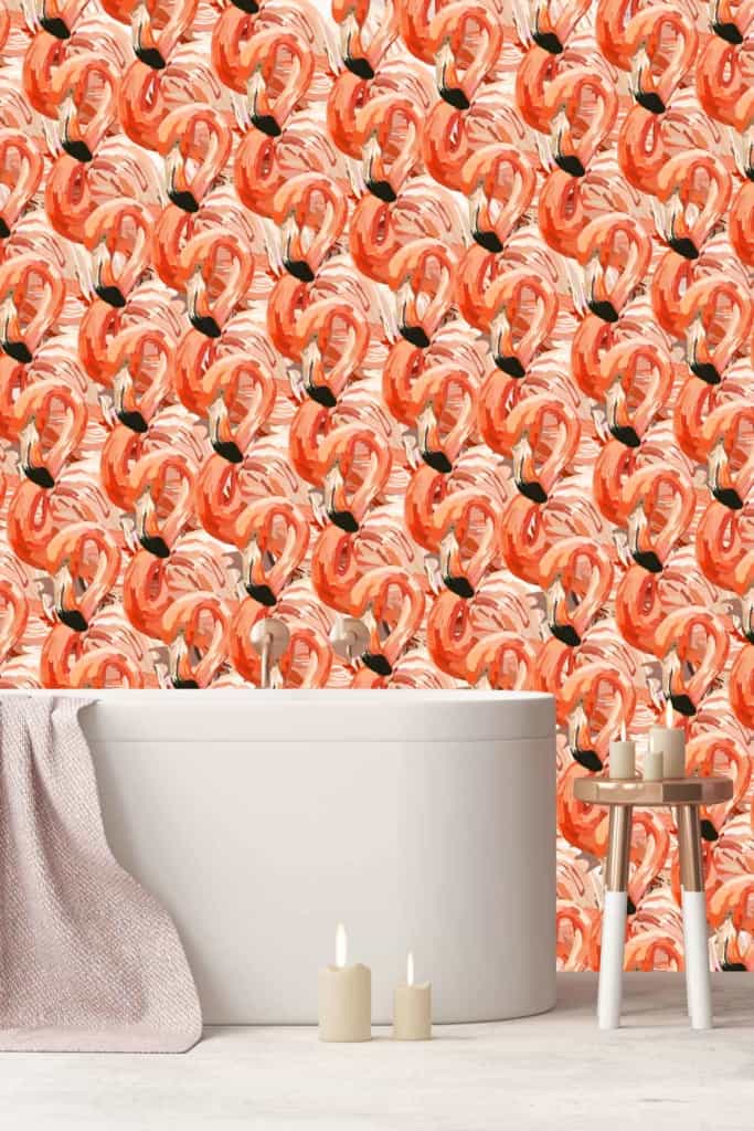 The wallpaper features vibrant, abstract designs of red and orange pomegranates. The bold hues subtly echo the colors of flamingos, creating a lively and dynamic backdrop.