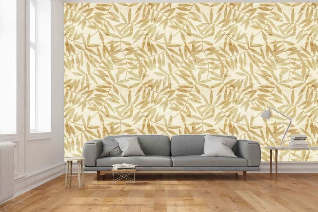 A striking accent wall showcases a beige and white leaf pattern.