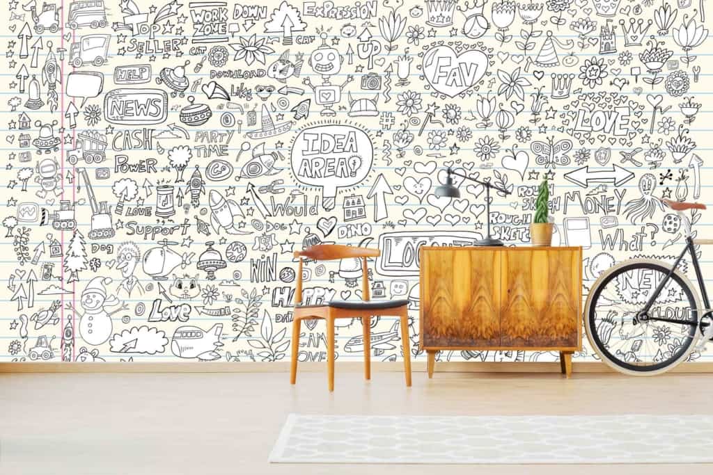 The wallpaper features whimsical hand-drawn doodles including hearts, stars, arrows, flowers, and various words and phrases. The colors on the wallpaper incorporate a mix of vibrant and subtle tones to create an artistic effect.