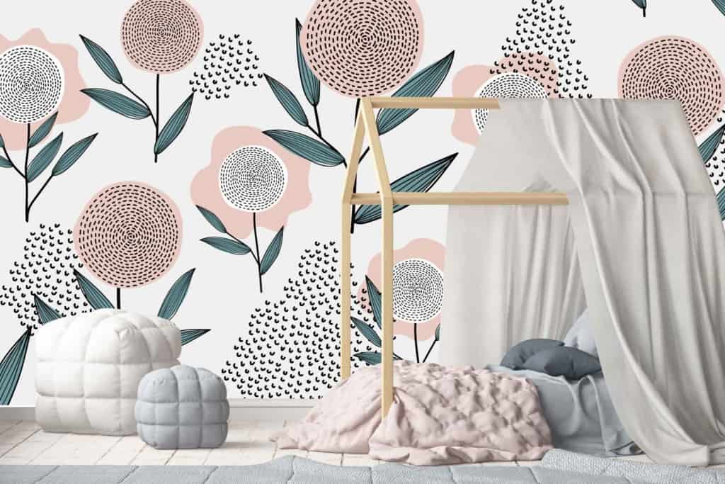 The children's bedroom features whimsical floral wallpaper adorned with enchanting flowers, delicate leaves, and delightful butterflies. The color palette includes soft pastels like blush pink, mint green, and lavender purple interspersed with touches of sunny yellow and sky blue. These elements create a dreamy backdrop perfectly suited for little dreamers like Jessie.