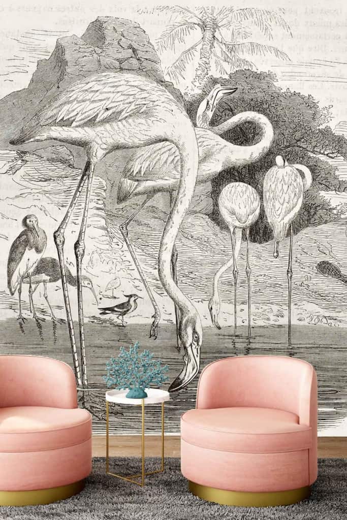 The wall mural displays vintage illustrations of flamingos in a natural setting, featuring detailed trees and serene water elements. The colors include soft pinks from the flamingos, lush greens from the trees, and calm blues for the water.