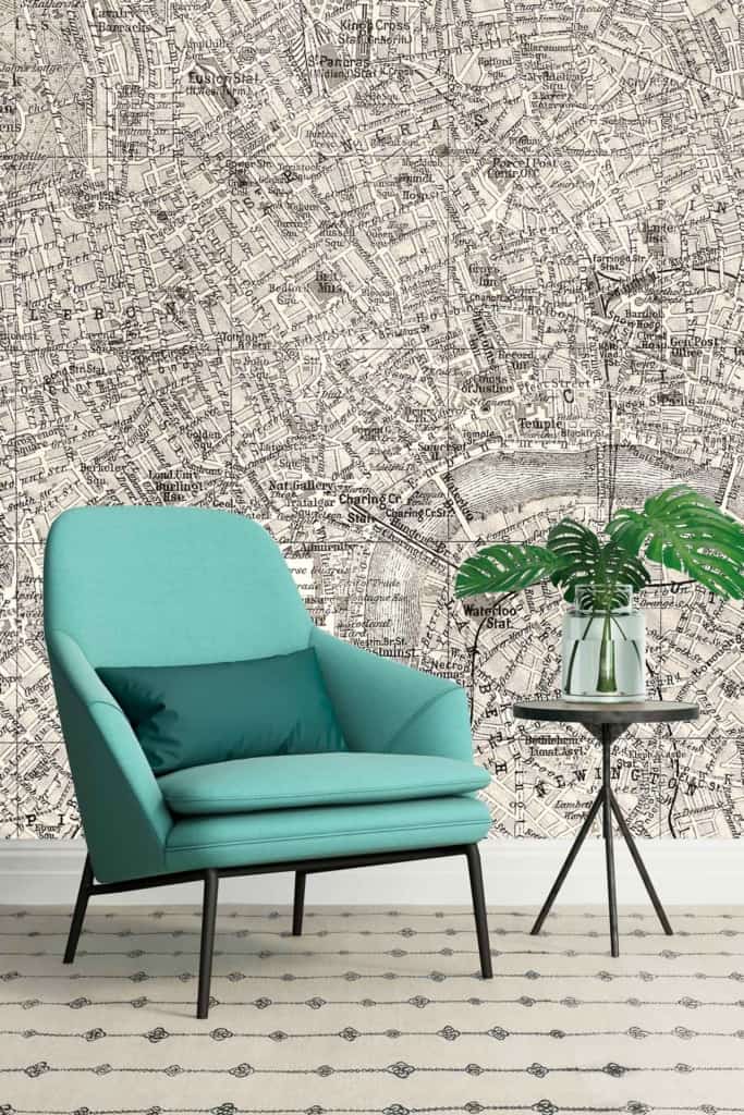 The wallpaper features a vintage map highlighting London, with intricate lines and detailed cartography. It showcases muted colors including sepia tones, shades of beige, and faded black. Familiar landmarks and street names are distinctly marked, evoking an old-world charm.