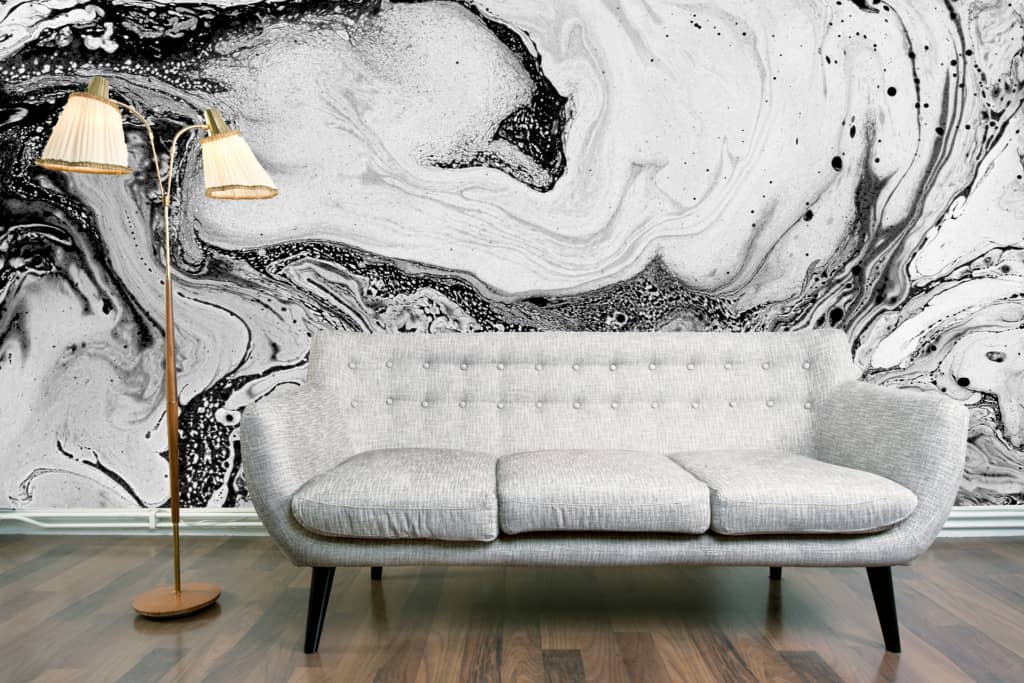 The wallpaper features a striking black and white marbled design.
