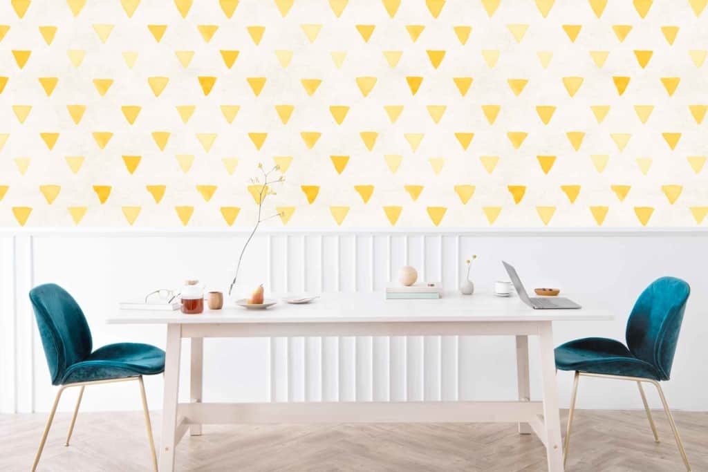 Mellow yellow triangular patterns on the wall.