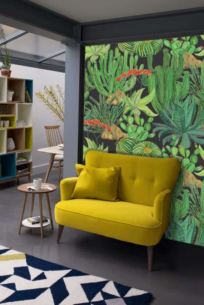 The wallpaper is vibrant and desert-themed, featuring various green cacti and red flowers.