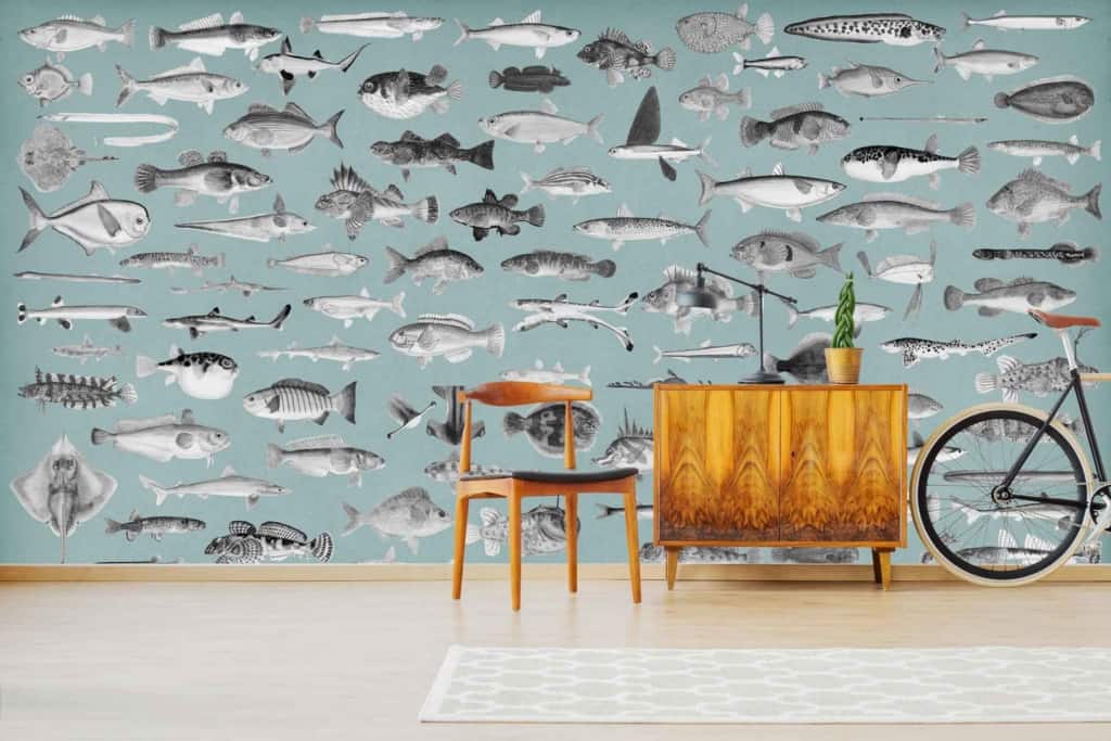 A blue wall features various black and white fish illustrations, giving the space an "Off The Hook" vibe.