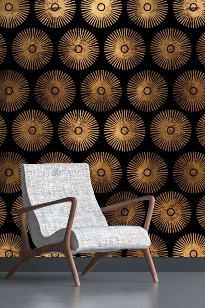 A striking black wallpaper adorned with radiant gold circular patterns creates an intricate, luxurious, and elegant backdrop. The interplay of the bold black base color with the shimmering gold designs sets a visually stunning and sophisticated stage.