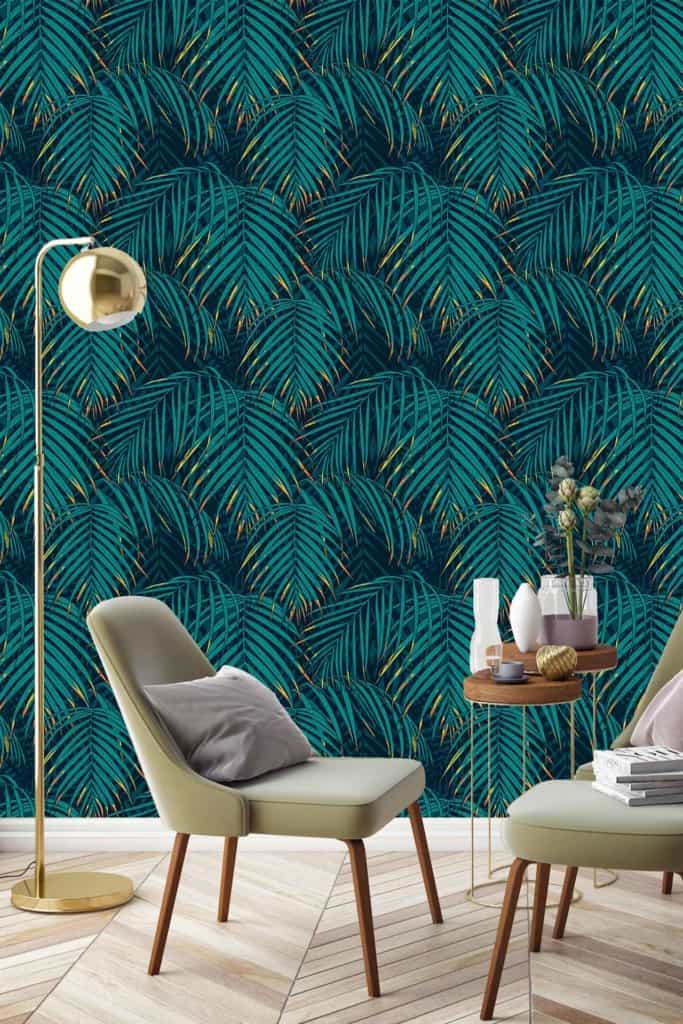 Bold tropical leaf wallpaper in shades of teal and blue, evoking Victoria's Secret elegance. Vibrant teal, rich blue hues, leafy patterns.