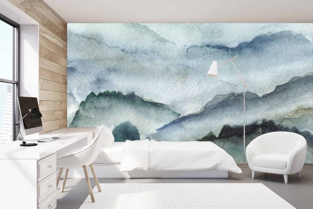 A modern bedroom features a wall mural with abstract blue and green mountains, resembling erosion by time. Colors: blue, green, abstract.