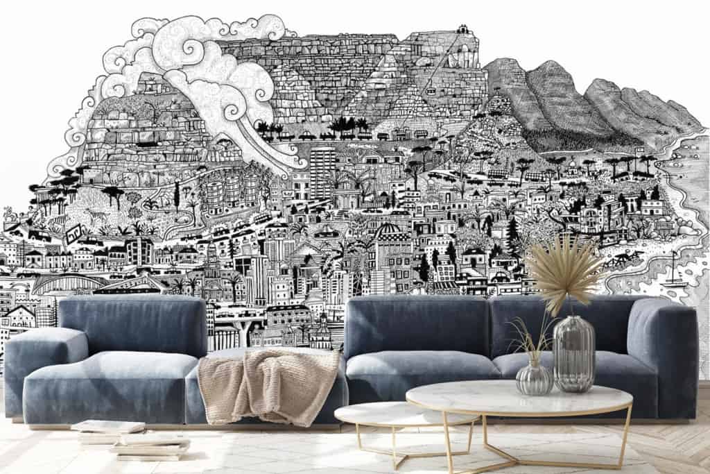 The black-and-white mural wallpaper features a detailed cityscape reminiscent of Cape Town. Key elements include buildings, trees, and mountains in the background. The entire mural is monochromatic, emphasizing intricate urban and natural details without any color distractions.