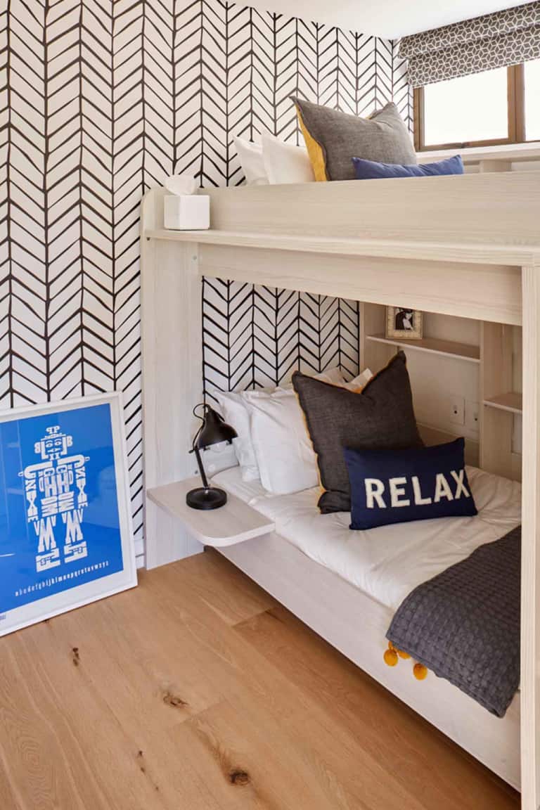 The wallpaper features a striking black and white herringbone pattern.