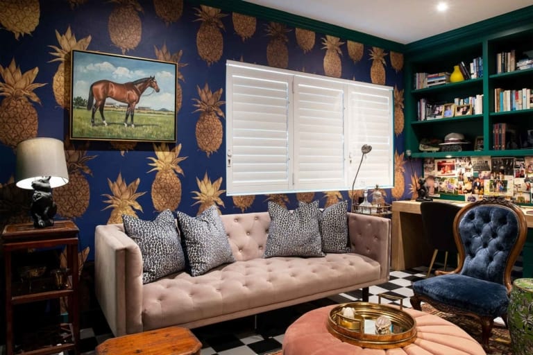 The wallpaper is dark blue with a pineapple pattern.