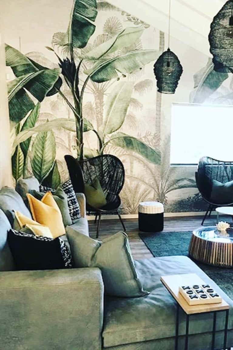 Tropical leaf mural featuring lush green leaves, vibrant yellow highlights, and subtle tropical colors. Perfect for adding a fresh, natural touch to any space.
