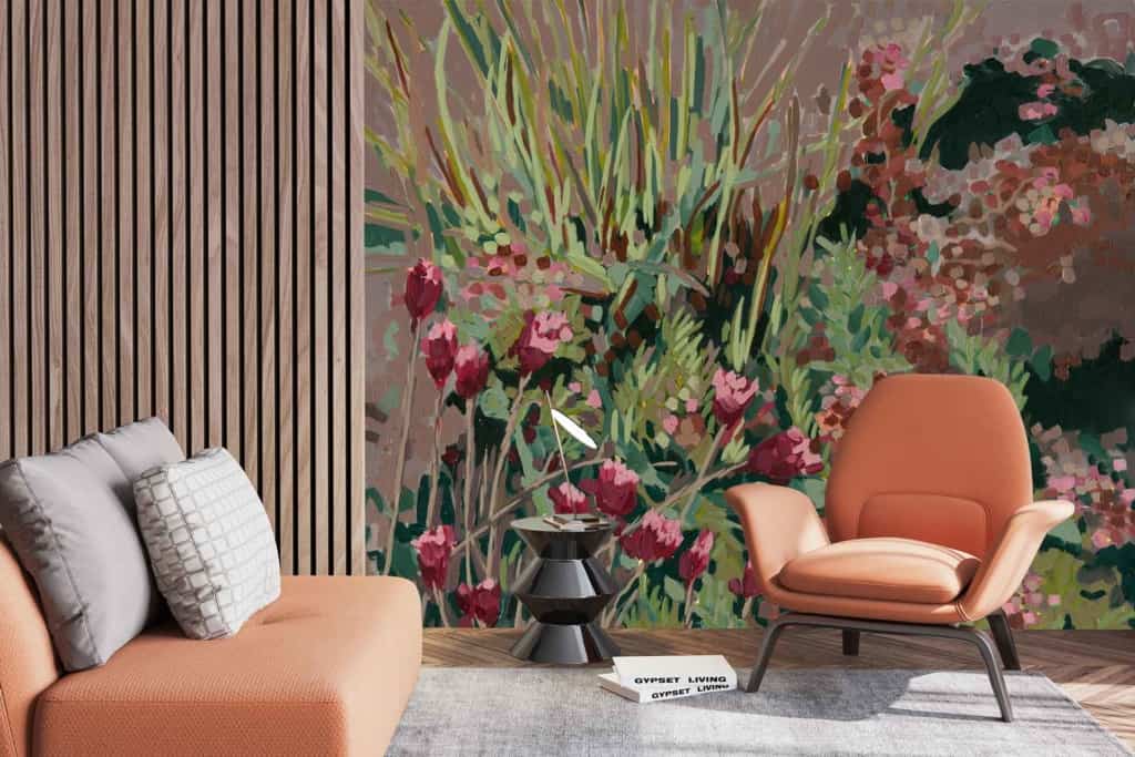 The wallpaper features vibrant abstract greenery and pink flowers, creating a lively, nature-inspired ambiance. Elements include leafy patterns in various shades of green and stylized floral designs in pink hues.