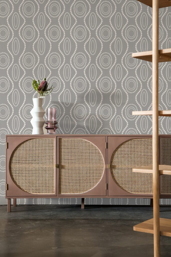 The patterned wallpaper features a mix of gray and white circular designs.