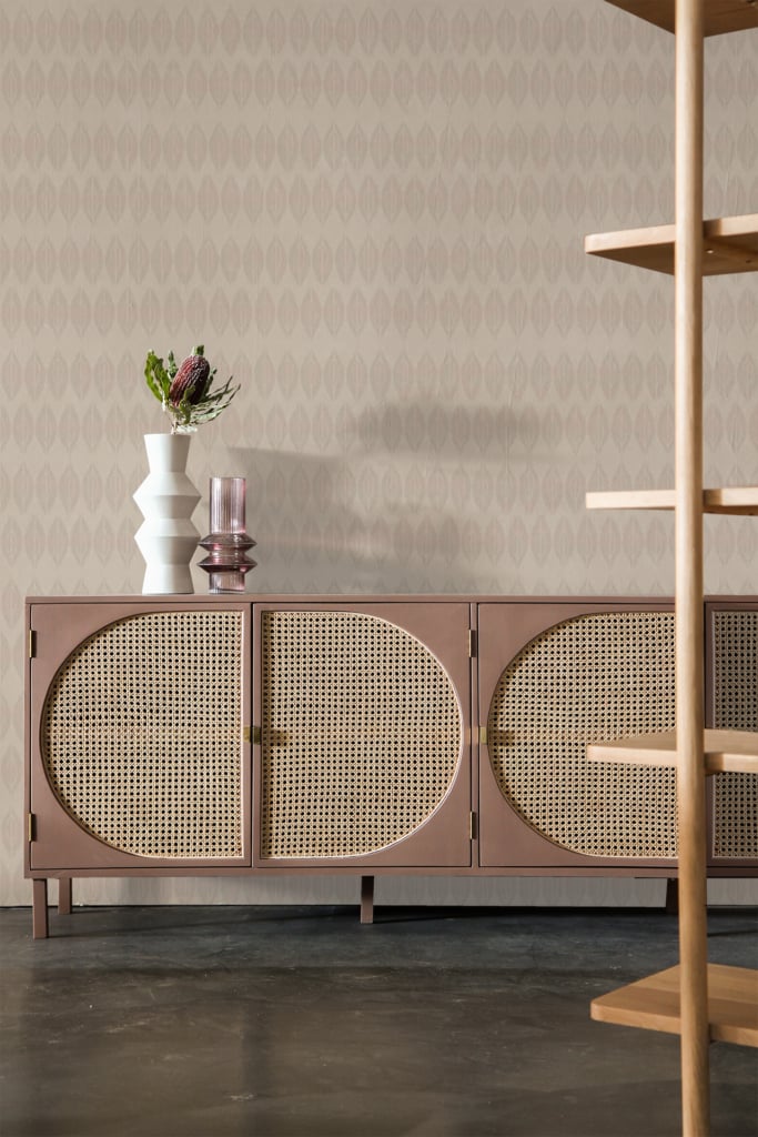 Patterned beige wallpaper featuring intricate designs, geometric shapes, and subtle textures.