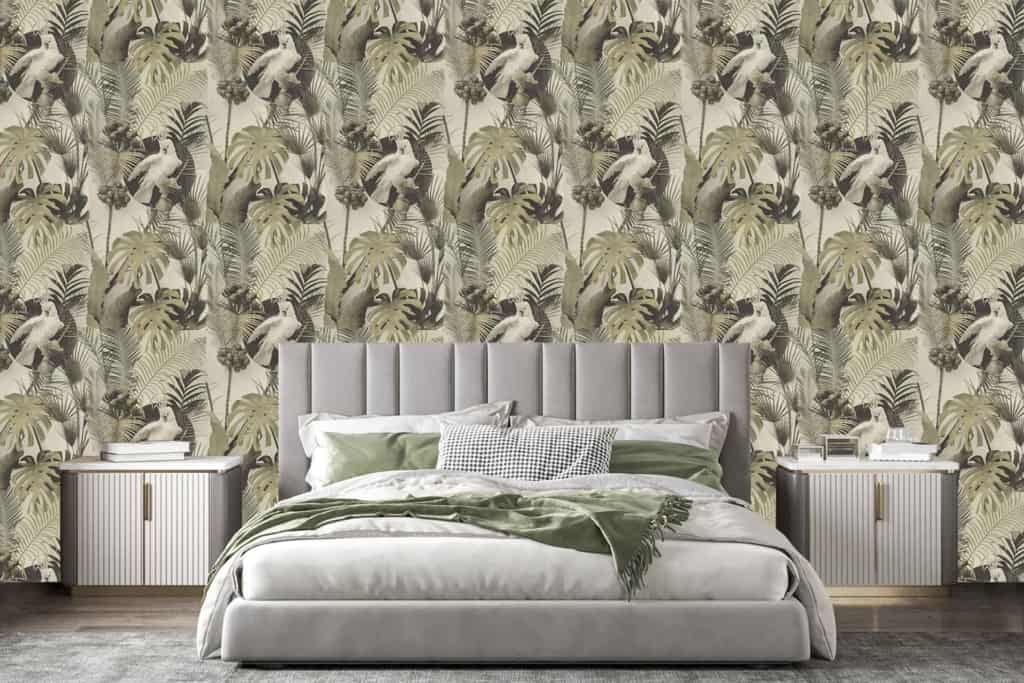 The wallpaper features a tropical theme with lush green leaves and fern illustrations. The elements include various shades of green, detailed leaf patterns, and natural botanical designs that add a refreshing touch to the room.
