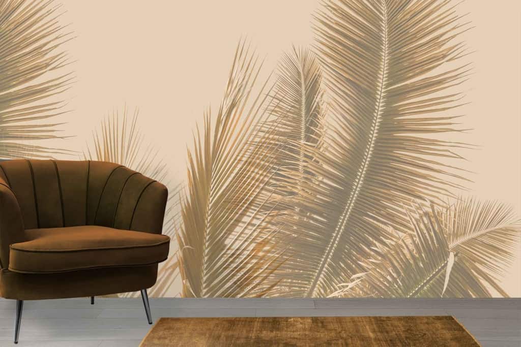 Beige-toned palm fronds on wallpaper backdrop.