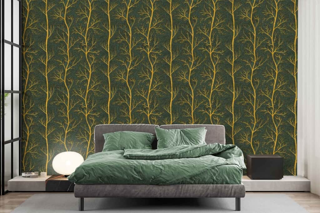 The wallpaper behind the bed features a dark green background with a golden botanical pattern. The elements include various leaf and floral designs in metallic gold set against the rich, deep green backdrop.