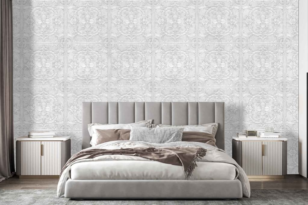 The wallpaper features an intricate pattern with shades of soft grey, muted gold accents, and delicate white highlights. The design includes elegant floral motifs and geometric shapes that add depth and sophistication to the room.