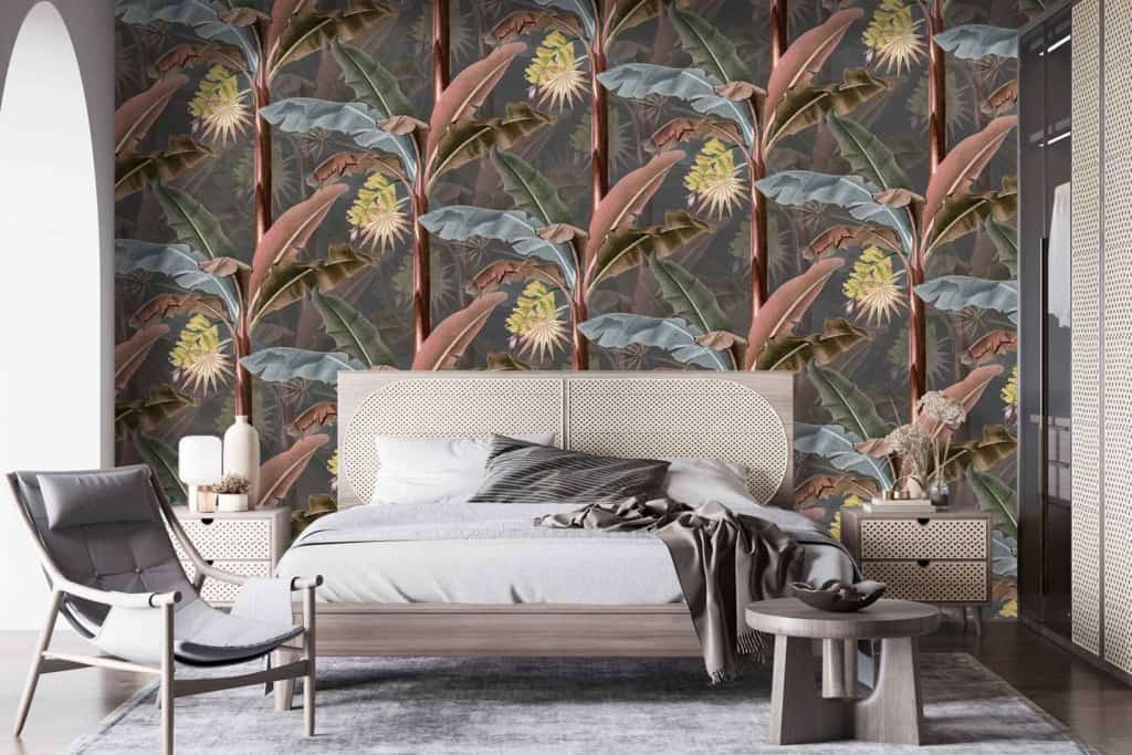 The wallpaper showcases a vibrant tropical leaf and flower pattern with lively elements of green leaves, exotic blue flowers, and splashes of pink and yellow hues. This colorful design contrasts beautifully against the neutral tones of the room.