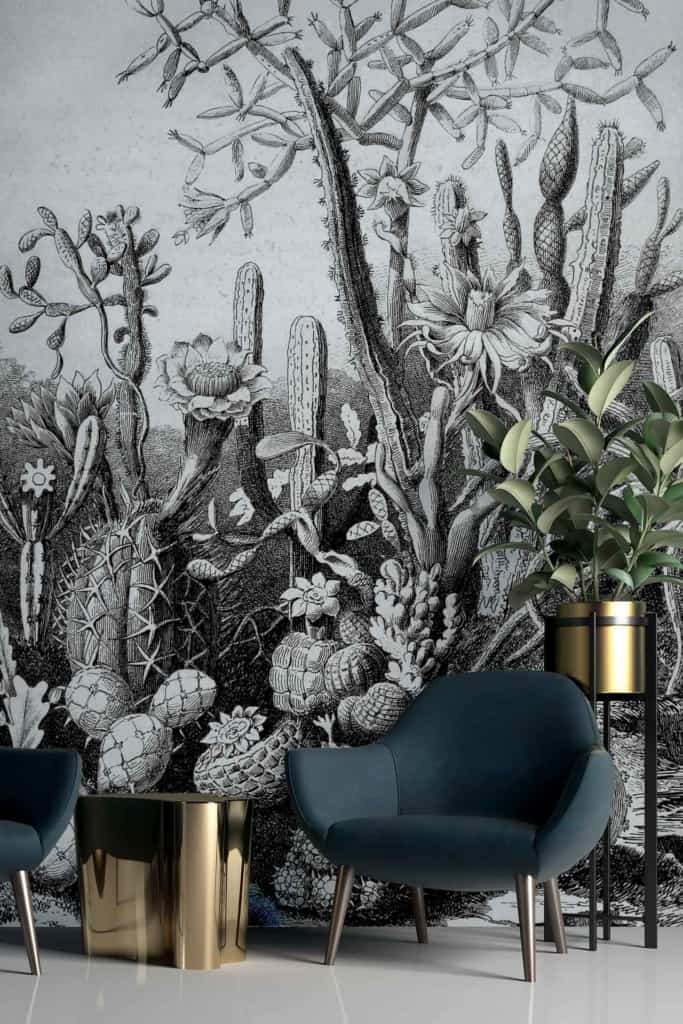 The wallpaper is a detailed black and white botanical mural featuring various cacti.