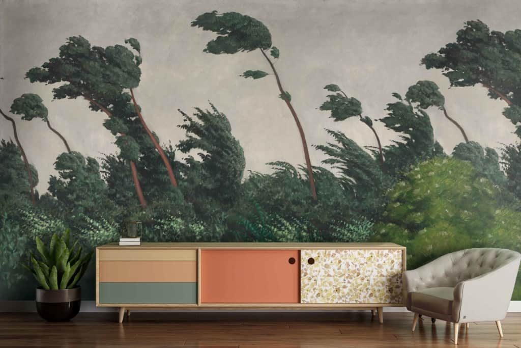 Large mural, windswept trees, foliage, nature-inspired, green leaves, brown tree trunks, scenic landscape.