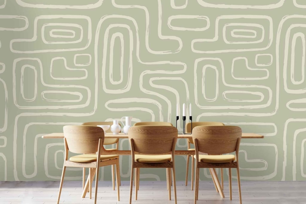 The wallpaper features a light green abstract geometric pattern. It consists of various shapes and angles, creating an intricate design. The primary color is a soft, pastel green, with hints of white integrated into the geometric elements. This combination gives the wallpaper a fresh and modern look.