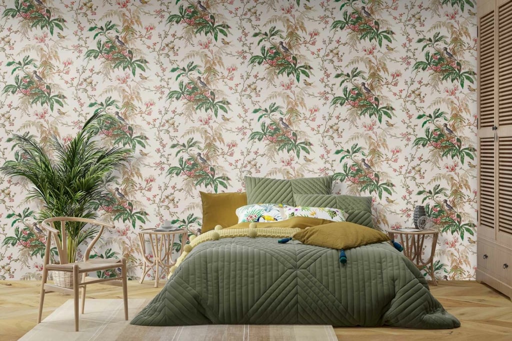 The wallpaper features green leaves and colorful flowers. It includes shades of lush green foliage, vibrant blooms in hues of pink, yellow, blue, and red. The botanical theme is emphasized by intricate leaf patterns interspersed with vividly colored petals and delicate stems, creating a lively and natural aesthetic.