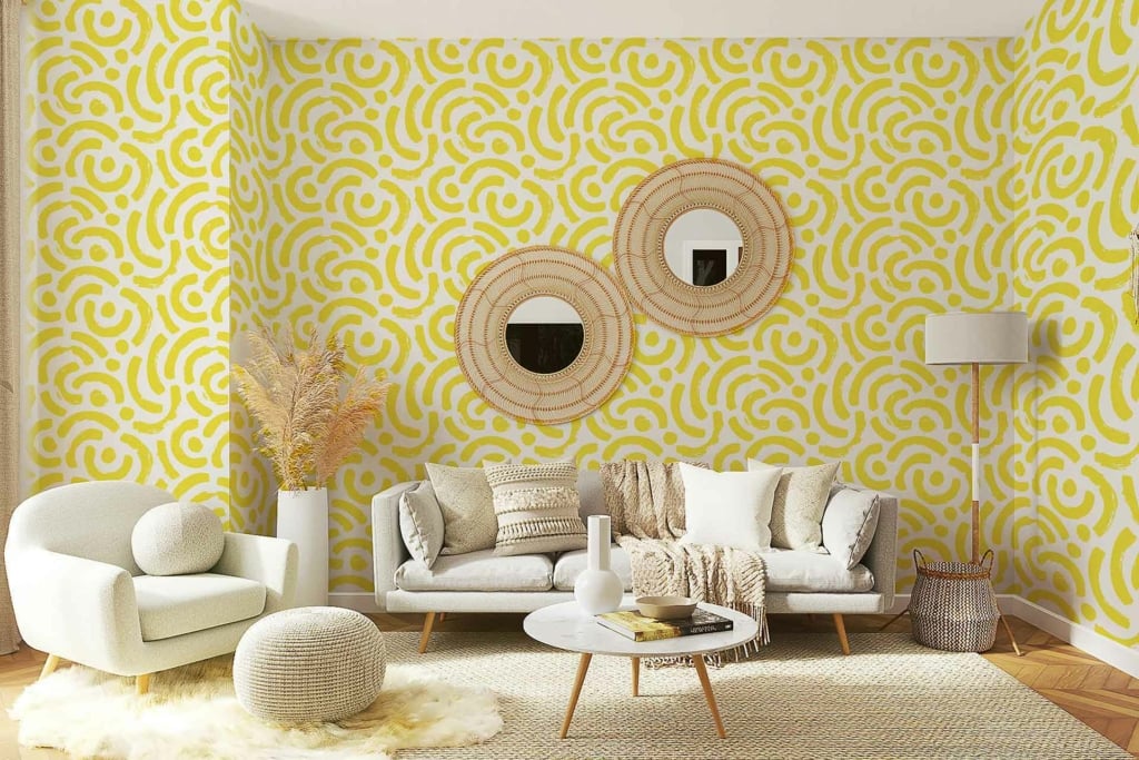 Vibrant yellow patterned wallpaper featuring intricate geometric shapes and floral motifs in shades of gold, white, and subtle hints of green.