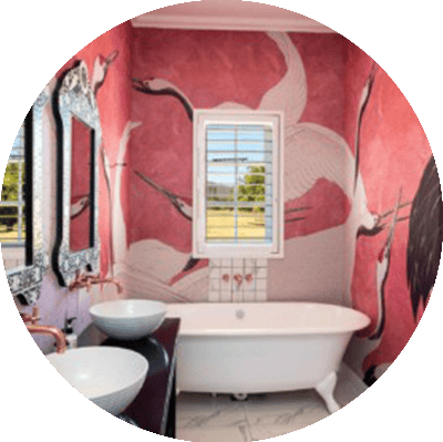 Elaborate mural wallpaper features white cranes on a red background.