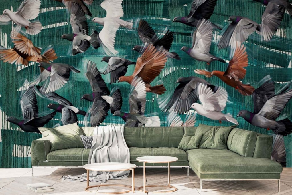 The large wall mural displays messenger birds in various colors flying against an abstract green background. Key elements include birds in flight and a green, abstract backdrop.