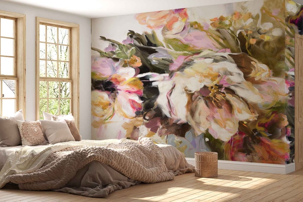 A large, vibrant floral mural covers one wall, featuring an array of blooming flowers in bold hues such as deep reds, vivid oranges, soft pinks, and lush greens. The intricate details showcase delicate petals and rich foliage with subtle brushstrokes adding depth. This eye-catching wallpaper infuses the bedroom with color and nature-inspired elegance.