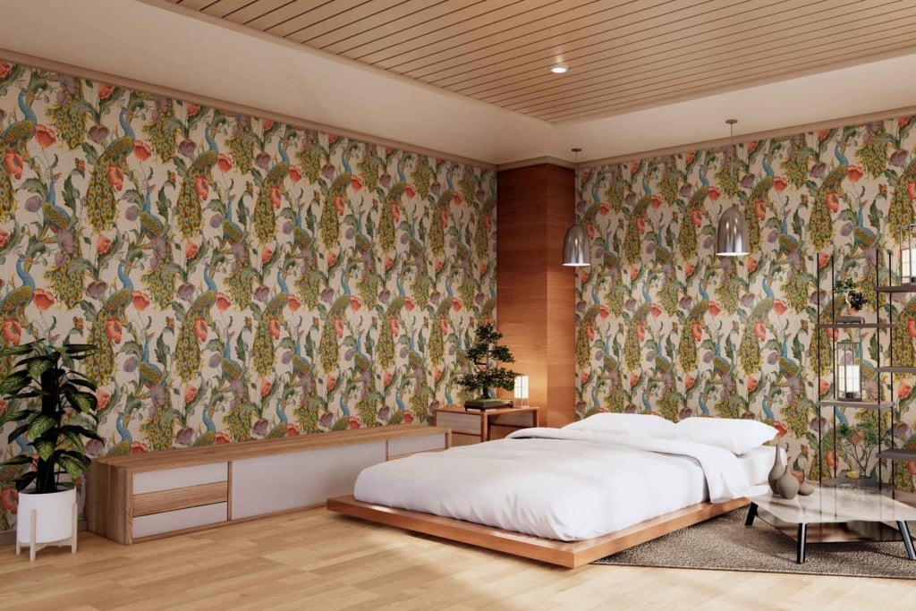 Colorful floral-patterned wallpaper featuring vibrant hues of pink, yellow, green, and blue. The design includes large flowers with intricate petal details, interspersed leaves, and delicate vines forming an elaborate tapestry. The background is a subtle off-white that makes the colors pop.