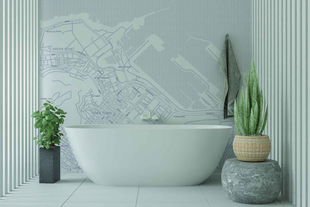 The wallpaper in this modern bathroom features a world map design, illustrated to resemble a detailed blueprint. The map consists of intricate lines and markings, predominantly in shades of blue and white, evoking a classic yet contemporary aesthetic.