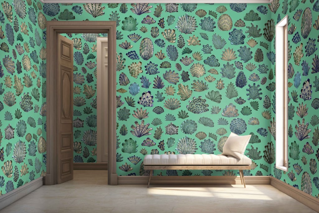 A room with vibrant, sea-themed wallpaper featuring an array of colorful corals on a teal background. The design includes reds, oranges, yellows, and purples set against various shades of teal.