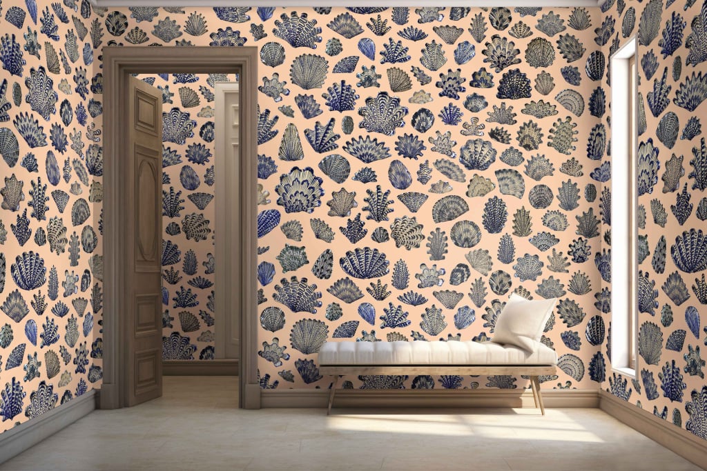 Wallpaper features vibrant pattern of blue coral, gray coral, and sea plants on a peach background.