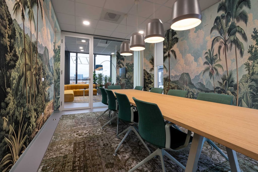 Tropical-themed wallpaper featuring vivid palm trees, lush green foliage, and majestic mountains in serene hues. Rich greens of leaves contrast with varying shades of blue and turquoise sky, punctuated by hints of sandy beige for a natural look. The design invites exploration and creativity through its vibrant yet calming palette.